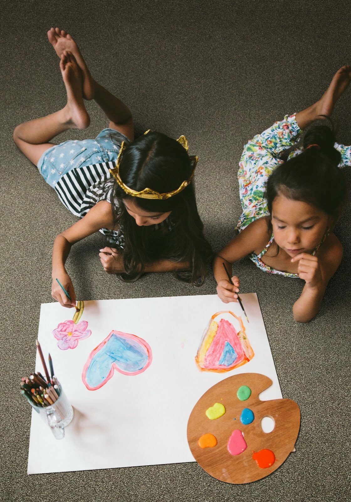 Kids drawing laying on soft Carpet | T And H Floor Store