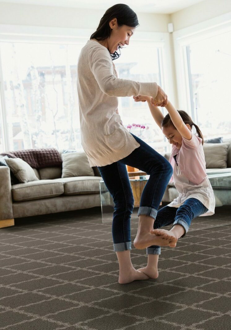 Mom playing with baby on Carpet flooring | T And H Floor Store